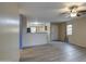 Living room with tile floors and a view of the kitchen at 9909 W Miami St, Tolleson, AZ 85353