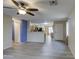 Living room with tile floors and ceiling fan at 9909 W Miami St, Tolleson, AZ 85353