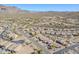 Aerial view of a residential neighborhood with desert landscape and mountains in the background at 10255 E Golden Rim Cir, Gold Canyon, AZ 85118