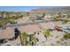 Aerial view of a home's backyard with a pool and desert landscaping at 10255 E Golden Rim Cir, Gold Canyon, AZ 85118