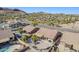 Aerial view of a home's backyard with a pool and desert landscaping at 10255 E Golden Rim Cir, Gold Canyon, AZ 85118
