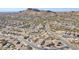 Aerial view of a residential neighborhood with desert landscape and mountains in the background at 10255 E Golden Rim Cir, Gold Canyon, AZ 85118