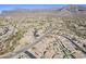 Aerial view of a residential neighborhood with desert landscape and mountains in the background at 10255 E Golden Rim Cir, Gold Canyon, AZ 85118
