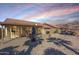 Backyard patio with seating area and mountain views at 10255 E Golden Rim Cir, Gold Canyon, AZ 85118