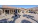 Spacious backyard with covered patio, grill, and desert landscaping at 10255 E Golden Rim Cir, Gold Canyon, AZ 85118