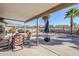 Relaxing backyard with gravel landscaping, featuring patio furniture and mountain backdrop at 10255 E Golden Rim Cir, Gold Canyon, AZ 85118