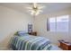 Bedroom with ceiling fan and wood floors at 10255 E Golden Rim Cir, Gold Canyon, AZ 85118
