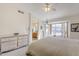 Main bedroom with large window, ceiling fan, and ensuite bathroom access at 10255 E Golden Rim Cir, Gold Canyon, AZ 85118