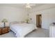Main bedroom with ceiling fan, large closet, and access to bathroom at 10255 E Golden Rim Cir, Gold Canyon, AZ 85118