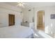 Main bedroom with ceiling fan, access to bathroom and hallway at 10255 E Golden Rim Cir, Gold Canyon, AZ 85118