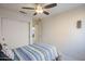 Bedroom with wood floors, ceiling fan and window at 10255 E Golden Rim Cir, Gold Canyon, AZ 85118