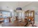 Bright dining area with wooden table and hutch, offering a welcoming atmosphere at 10255 E Golden Rim Cir, Gold Canyon, AZ 85118