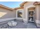 Entryway with decorative door and small garden at 10255 E Golden Rim Cir, Gold Canyon, AZ 85118