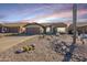 Front view of a single-story house with desert landscaping at 10255 E Golden Rim Cir, Gold Canyon, AZ 85118