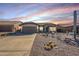Front view of a single-story house with desert landscaping at 10255 E Golden Rim Cir, Gold Canyon, AZ 85118