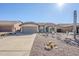 Front view of a single-story house with desert landscaping at 10255 E Golden Rim Cir, Gold Canyon, AZ 85118