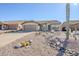 Front view of a single-story house with desert landscaping at 10255 E Golden Rim Cir, Gold Canyon, AZ 85118