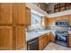 Oak kitchen with stainless steel appliances and ample counter space at 10255 E Golden Rim Cir, Gold Canyon, AZ 85118