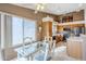 Bright kitchen with oak cabinets, stainless steel appliances, and an adjacent dining area at 10255 E Golden Rim Cir, Gold Canyon, AZ 85118