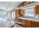 Kitchen with oak cabinets, stainless steel appliances, and view of backyard at 10255 E Golden Rim Cir, Gold Canyon, AZ 85118