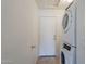 Laundry room with washer, dryer, and door at 10255 E Golden Rim Cir, Gold Canyon, AZ 85118