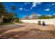 Landscaped backyard with gravel and block wall at 10428 E Hercules Dr, Sun Lakes, AZ 85248