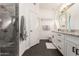 Updated bathroom with granite vanity, large mirror, and walk-in shower at 10428 E Hercules Dr, Sun Lakes, AZ 85248