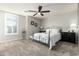 Bright bedroom with carpeted floor and metal bed frame at 10428 E Hercules Dr, Sun Lakes, AZ 85248