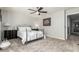 Cozy bedroom featuring a metal bed frame and ceiling fan at 10428 E Hercules Dr, Sun Lakes, AZ 85248