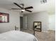 Well-lit bedroom with ceiling fan and mirrored walls at 10428 E Hercules Dr, Sun Lakes, AZ 85248