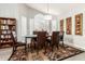 Spacious dining area with a large table, comfortable seating, and decorative wall art at 10428 E Hercules Dr, Sun Lakes, AZ 85248