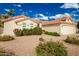 Single-story home with two-car garage and desert landscaping at 10428 E Hercules Dr, Sun Lakes, AZ 85248