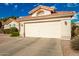 View of a two-car garage with white door at 10428 E Hercules Dr, Sun Lakes, AZ 85248