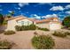 Single-story home with attached two-car garage and front yard landscaping at 10428 E Hercules Dr, Sun Lakes, AZ 85248