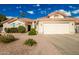 Single-story home with attached two-car garage and desert landscaping at 10428 E Hercules Dr, Sun Lakes, AZ 85248