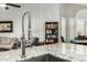 Sleek kitchen with a modern faucet and granite countertops at 10428 E Hercules Dr, Sun Lakes, AZ 85248