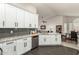 Modern kitchen with white shaker cabinets, granite counters, and stainless steel appliances at 10428 E Hercules Dr, Sun Lakes, AZ 85248