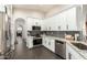 Updated kitchen with white cabinets, granite countertops, and stainless steel appliances at 10428 E Hercules Dr, Sun Lakes, AZ 85248