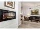 Cozy living room with a modern electric fireplace and comfortable seating at 10428 E Hercules Dr, Sun Lakes, AZ 85248