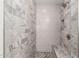 Modern shower with marble tile and built-in seat at 10428 E Hercules Dr, Sun Lakes, AZ 85248