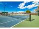 Well-maintained tennis court with blue and green surface at 10428 E Hercules Dr, Sun Lakes, AZ 85248
