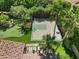 Aerial view showing backyard with sports court and putting green at 11571 E Cochise Dr, Scottsdale, AZ 85259