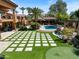 Luxury home with a large backyard, pool, and sport court at 11571 E Cochise Dr, Scottsdale, AZ 85259
