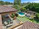 An aerial view highlighting the luxurious backyard with a pool, spa, and beautifully landscaped grounds at 11571 E Cochise Dr, Scottsdale, AZ 85259