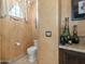 Charming bathroom with warm colors, decorative accents, and a classic design at 11571 E Cochise Dr, Scottsdale, AZ 85259