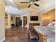 A spacious main bedroom features hard wood floors and tray ceiling at 11571 E Cochise Dr, Scottsdale, AZ 85259