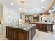Spacious kitchen featuring granite countertops, custom cabinets, and a large island at 11571 E Cochise Dr, Scottsdale, AZ 85259