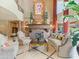 Elegant living room featuring a fireplace, curved sofa, and statement artwork at 11571 E Cochise Dr, Scottsdale, AZ 85259
