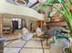 Grand living room with a fireplace, soaring ceilings, and marble floors at 11571 E Cochise Dr, Scottsdale, AZ 85259