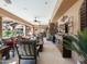 Spacious covered patio with comfortable seating and outdoor kitchen at 11571 E Cochise Dr, Scottsdale, AZ 85259